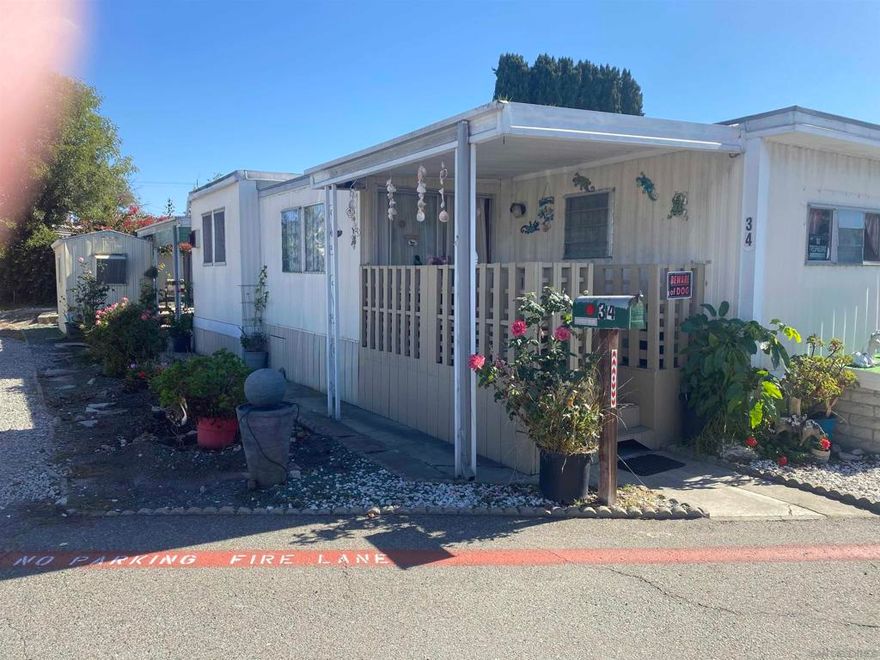 Terrace Gardens is a family mobile home park in Oceanside and has the lowest space rent in town. 2BD/1BA home has large lot with outdoor shed and plenty of room for garden in back.  Park has a new pool and a clubhouse for family enjoyment.  Community laundry.  Close to Sprinter station , local freeways and all ammenities.  Just a quick drive to beach or harbor and enjoy the California sunshine. Some TLC can make this home your today!