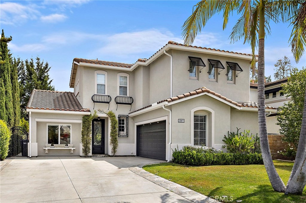 EXQUISITE DESIGNER HOME in a 24-hr guarded gated community of Stoneridge. Located in one of the area’s most private and sought-after neighborhoods, this beautifully Totally remodeled residence blends luxury, functionality, and refined style. With 4 bedrooms, 2.5 bathrooms, and over 2500 SQFT. the layout is ideal for modern family living and effortless entertaining.
A long driveway leads to a spacious entrance, opening into a formal living room, elegant dining area, and a warm family room anchored by a newly remodeled fireplace. Wide-plank flooring, custom RH lighting, and motorized window treatments enhance the sophisticated design throughout. The open-concept kitchen has been completely reimagined with new cabinetry, designer countertops, premium appliances, and RH pendant lighting—seamlessly flowing into the family space. and a thoughtfully designed office
Upstairs, the primary suite offers a spa-like bath with black stone shower flooring, soaking tub, upgraded vanities, and a generous walk-in closet. Three additional bedrooms, fully remodeled bathrooms, and a separate laundry room complete the upper level. Every bath features high-end tile, fixtures, and glass enclosures.
The private backyard has been transformed with sleek concrete tile, a brand-new patio cover, and starry café lighting—perfect for relaxing or entertaining. A mature lemon tree adds a touch of charm, visible from both the kitchen and upstairs bedroom. Additional upgrades include full-house re-piping, custom media wall, remodeled garage with epoxy floors and polyaspartic finish, brand-new HVAC, fresh interior/exterior paint, and recessed lighting with dimmers throughout.
This home is truly move-in ready, offering elevated design in a peaceful gated setting. A rare opportunity not to be missed.