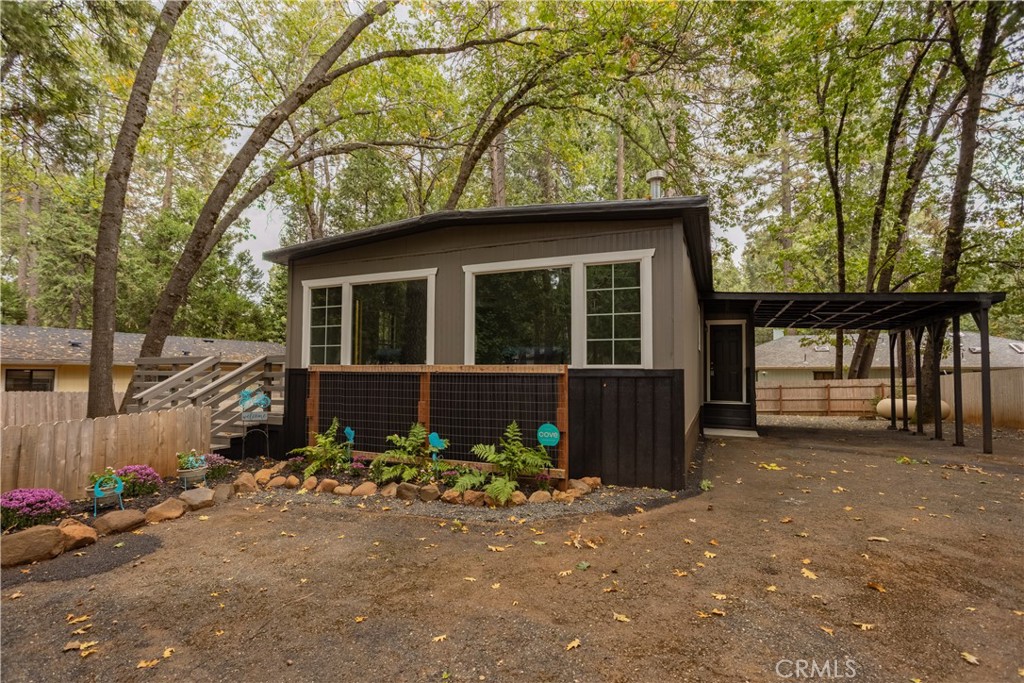 Move-In Ready Charm: Fully Updated 2 Bed, 2 Bath Manufactured Home on Land 
Discover your new sanctuary! This beautifully updated 2-bedroom, 2-bathroom manufactured home offers a blend of modern comfort and peaceful living. Situated on its own .23 acre lot in a quiet cul-de-sac location, this property is truly move-in ready.
The interior boasts a fresh, modern aesthetic with new paint, new flooring, and new lighting fixtures, including LED lighting throughout. The kitchen is fully equipped with new, modern appliances, and a new washer and dryer are included for convenience.
Enjoy efficient, reliable climate control year-round from the central heat and air system, which is only 6 years old. A freestanding propane heater in the living room adds extra warmth for cozy winter evenings. Step out onto the large side deck, perfect for relaxing outdoors, morning coffee, or BBQs. Parking and storage are excellent, with both a 1-car garage and a brand-new carport featuring new LED lights.
This is a 1971 model manufactured home on land with 2 bedrooms and 2 bathrooms, utilizing all-electric utilities, public water, and a septic tank. It is located in a quiet cul-de-sac. Private financing is available.
Don't miss the chance to own this fantastic, low-maintenance home where all the hard work has already been completed! Contact us today to schedule your private showing.As a resident, you'll gain access to an impressive list of community amenities for an annual HOA fee of just $310 ($25/mo). Enjoy a resort-like experience with a pool, spa, and sauna, or stay active on the tennis and pickleball courts. The association also offers various social spaces, including picnic areas and card rooms.
