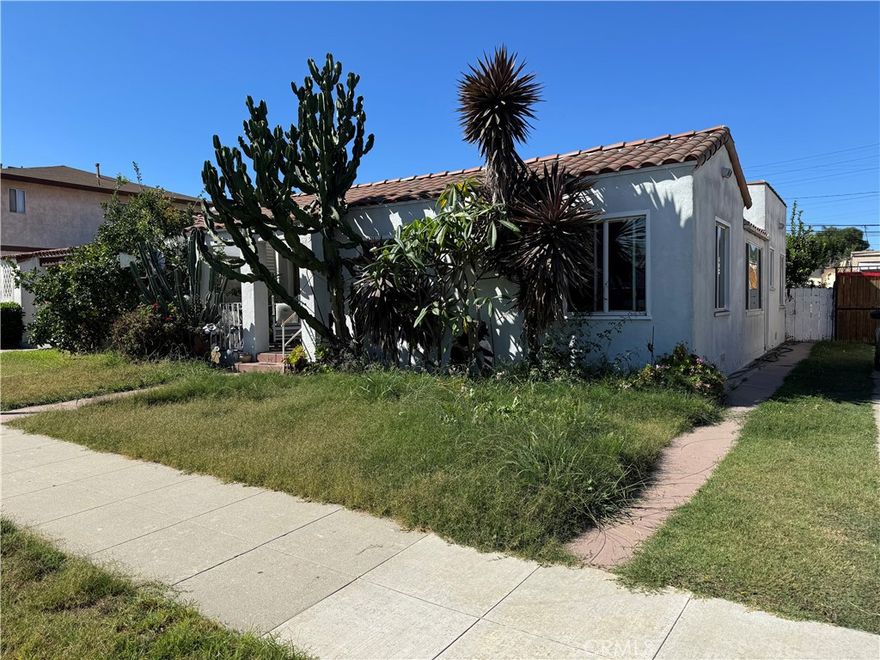 Nice Spanish-style home. This home has been a great family home and is looking for a new owner to make it their home. The wall separating two of the bedrooms has been removed, however it is easy to replace the wall, if desired. Garage opens to alley. Relax in your private yard. Looking for extra space or extra income? Plenty of room to add an ADU. Check with the city for details but consider the potential! This home is conveniently close to Target, supermarkets, and a variety of restaurants. Being in Long Beach means you are close to many great attractions including the Queen Mary, beaches, Disneyland, and more! If you are looking for a great starter home, then this is your opportunity to get a single family home at a condo price!