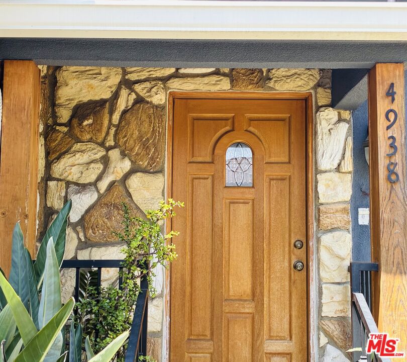 Nestled on a quiet, tree-lined street in Los Angeles with a coveted Culver City address, this beautifully updated two-story single-family pool home offers the perfect blend of comfort, style, and convenience. Featuring 3 spacious bedrooms and 3 modern bathrooms, this residence boasts an open floor plan that seamlessly connects the living, dining, and kitchen areas--ideal for both entertaining and everyday living. Enjoy the convenience of a floor plan offering 2 bedrooms and 2 bathrooms on the main level. Step into a bright and inviting living room warmed by a cozy fireplace and enhanced by recessed lighting throughout. The remodeled kitchen is a chef's dream with sleek countertops, stainless steel appliances, and custom cabinetry, opening to a nearby dining area with elegant French doors that lead to the backyard oasis. Upstairs, the luxurious primary bedroom retreat offers a serene escape with ample space, a walk-in closet, and an en-suite bathroom. Outdoors, enjoy the California lifestyle with a sparkling pool, perfect for warm summer days, and plenty of space to relax or entertain. Additional highlights include eco-friendly solar panels, a covered carport, and proximity to local bike trails, parks, and popular restaurants. This exceptional home combines modern upgrades with a prime location, delivering the best of Westside living.