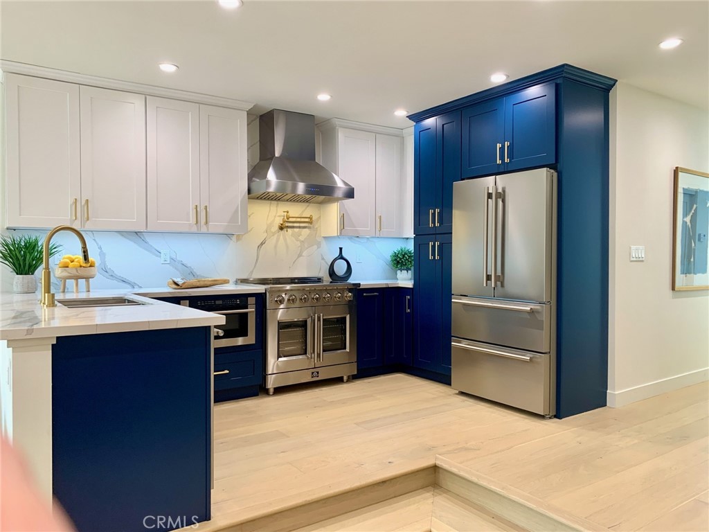 Welcome to this stunning, fully renovated 5-star townhome in the heart of Brentwood — where luxury living meets refined comfort. Boasting three bedrooms and three pristine bathrooms, every inch of this home has been meticulously upgraded to the highest standard. Enjoy the difference of true Townhome living with no neighbor above or below & easy, convenient access from your private parking to the very close proximity of your front door. Experience luxury living in this 3 bed, 3 bath townhome (1 Bed & 1 Bath downstairs) designed with impeccable detail, this 5-star residence features an open floor plan, hardwood floors, and designer finishes throughout. The gourmet kitchen boasts custom cabinetry, quartz counters with full backsplash and top-of-the-line stainless appliances. A spacious living area with cozy fireplace & elegant wet bar complete with beverage fridge, flows seamlessly between dining room & kitchen, ideal for entertaining. The primary suite offers a truly breathtaking spa-like bath with dual vanities, soaking tub, and oversized glass shower complete with bench & rain shower head! Secondary bedrooms are generous with beautifully updated baths, bedroom 2 upstairs has private entrance from upper level, great for guests. Additional highlights include inside laundry, brand new central AC, brand new vinyl windows throughout, recessed lighting, designer Kohler fixtures in kitchen and baths & pot filler above the kitchen range! No detail was missed and no expense spared in this high end luxury renovation! All this plus located on a quiet street near Brentwood’s finest shops, dining, schools parks & close by Santa Monica beach — this is refined California living at its best.