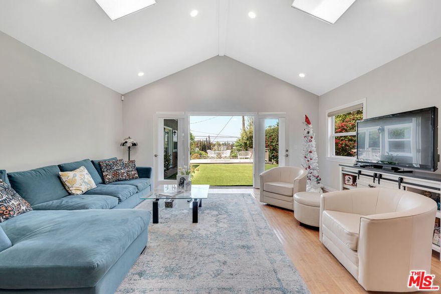 Celebrity property nestled in the sought after hills of Studio City South of the Blvd on a cul-de-sac, this was the home of late comedienne and actress Judy Tenuta. This elegantly appointed 3 bd + 3 ba with spacious 2,704 SF is a show stopper featuring crown molding, beautiful hardwood flooring, French doors, skylights, vaulted ceilings and abundant natural light. The inviting living room boasts a fireplace and a charming bay window. A spacious family room connects to the kitchen and dining room and features high-ceilings, skylights and French doors to the backyard and views of the hills. The kitchen is large with an abundance of oak cabinets, stainless steel appliances including Viking gas cooktop, Whirlpool fridge, built-in wall oven & microwave, Bosch dishwasher, granite counter tops and recessed lighting. Generously sized dining room next to the kitchen and living room with beautiful molding and chair railing. The stunning master retreat is enormous with high-pitched ceilings, recessed lighting, skylight, great sized walk-in closet and custom French doors and windows. The relaxing master bath is beautifully done with gorgeous marble counters, shower and a spa-tub. Inside laundry closet, washer & dryer stays. Two additional bedrooms shares a beautiful bathroom featuring a tub, marble shower & countertops. The backyard offers stunning sunset and city light views and features green turf and a large deck for entertaining, barbequing or relaxing. 2 security cameras and Ring doorbell. Crown molding, recessed lights, custom blinds, upgraded windows, tankless water heater. A great location, close to studios, Universal, entertaining, shopping, dining, DTLA and Westside! MOTIVATED SELLER. WILL LOOK AT ALL REASONABLE OFFERS!