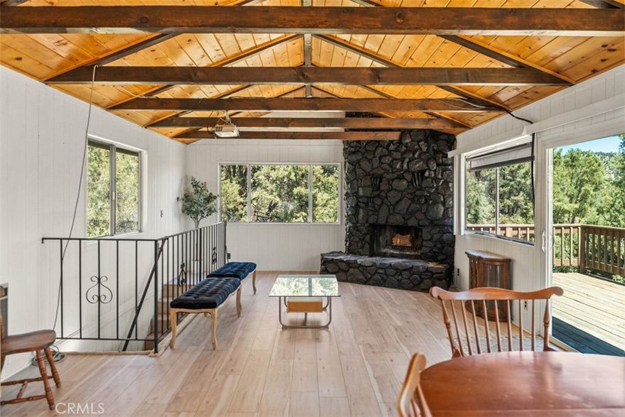 Discover Your Perfect Mountain Haven at 2204 Tirol Dr, Pine Mountain Club, CA. Picture yourself on the deck of a charming multi-level mountain cabin at 2204 Tirol Drive, sipping coffee as the sun rises over the stunning peaks of Pine Mountain Club. Tucked away on a peaceful cul-de-sac in the serene upper reaches of Tirol, this inviting retreat is surrounded by towering pines, offering a tranquil escape where the chaos of city life feels a world away.

Step inside to an open living area warmed by a beautiful stone fireplace, the heart of this cozy cabin. Freshly painted walls and new flooring give the space a bright, updated feel, blending seamlessly with its rustic mountain charm. Large windows frame breathtaking views of forested peaks, flooding the room with natural light and creating a perfect backdrop for morning reflections or lively gatherings with loved ones.This multi-level home is brimming with potential, featuring two comfortable bedrooms and a practical bathroom ready to welcome you. The under construction lower room is a versatile gem—perfect for a home office, workout space, or creative studio. With just a touch of TLC, this cabin’s solid foundation and recent updates can be transformed into your dream mountain haven. The spacious deck, ideal for barbecues or stargazing under a clear night sky, invites you to soak in the unparalleled beauty of the mountains. Living in Pine Mountain Club means embracing a vibrant community with access to a sparkling pool, welcoming clubhouse, scenic golf course, tennis courts, and 24/7 patrol for added peace of mind. Nearby trails and pine-scented air make every day feel like an adventure, all just steps from your door. Priced to sell, 2204 Tirol Drive is a mountain retreat with endless possibilities for those with a vision to make it their own. Sold AS IS, this home is a canvas for your creativity, ready to become an absolute gem with the right care. Come see it this weekend and let the mountains inspire your next chapter!