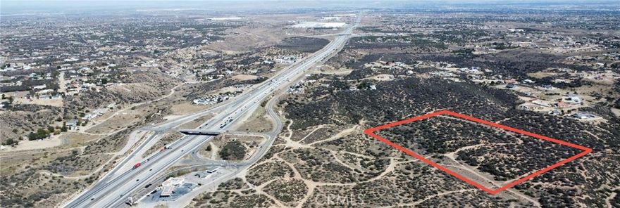 Prime ±10.88-Acre Full-Assembly Land Opportunity – East Oak Hills / Hesperia, CA
 Total Acreage: ±10.88 acres (APNs: 0357-305-04, -05, -06 & -07)
 Offering: Entire assemblage sold only as one unified site.
Key Highlights:
 • ±10.88-acre footprint offers scale, flexibility and visibility for destination-level development.
 • Situated at the gateway to the High Desert, at the top of the Cajon Pass, with approx. 250,000 vehicles per day pass the site.
 • New gas station currently under construction just off the freeway off-ramp, projected to open mid-2026 — proof of rising regional infrastructure and demand.
 • Utilities near the site reduce major infrastructure risk and accelerate the timeline to build-out.
 • Located in a high-growth region: The Victor Valley/High Desert metro is now estimated at ~619,000 people in 2025, up roughly 2% year-over-year.
  • At night, the site commands sweeping views of the High Desert city lights — making it ideal for a landmark destination with atmosphere and presence.
Ideal Uses:
 • Signature retail campus with one or more major anchors plus supporting retail/restaurants.
 • Hotel and hospitality destination with F&B, conference/banquet amenities, leveraging the freeway traffic & regional draw.
 • Multi-tenant commercial complex: service business, experience/entertainment venue, dining and shopping.
 • Destination lifestyle/entertainment hub: cinema or indoor recreation anchored by retail and food offerings — take advantage of night-time appeal and visibility.
Don’t miss this once-in-a-lifetime opportunity to secure a large, unified land asset zoned for regional commercial use in San Bernardino County’s Victor Valley / High Desert region.
