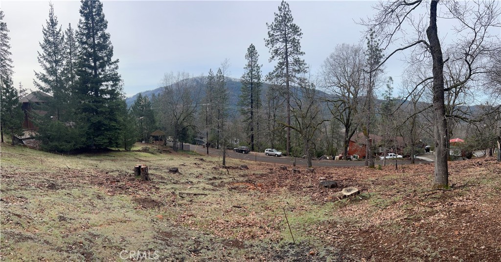 WONDEFUL MOUNTAIN VIEWS of Cobb Mt and the Mayacamas from a 0.31 acre parcel sloping up from the street facing to the south for sun, light and solar panels. Good soils analysis for a standard septic system at 75 ft per bedroom, so no need for a more expensive engineered system. Sought-after area of quality homes. It's easy to see your dream home built on this one. Seller will finance on $8,000 down, balance at 6% APR amortized over 5 years at $232 a month. Public water at street and community pool and golf course nearby.