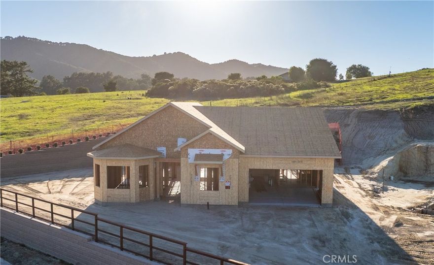 6741 Tierras Altas Lane is one of only eleven new homes remaining in the, Avila Canyon Estates, a gated cul-de-sac enclave embraced by the picturesque hills of the Avila Valley. This beautifully designed single-level luxury residence spans approximately 2,485 square feet on a 15,295 square foot homesite, offering an exceptional blend of comfort, elegance, and privacy. Inside, ten-foot ceilings and expansive glass doors and windows, fill the home with natural light, creating a seamless connection between the interior and the outdoors. The home provides a true open floor plan design with the living, dining, and kitchen flowing together. The great room impresses with a twenty-foot glass wall with two sliding doors that open to the covered California Room. A six-foot linear gas fireplace in the living room anchors the. The gourmet kitchen is a showcase of craftsmanship, featuring premium quartz countertops, soft-close shaker cabinetry, GE Café appliances, and a generous center island ideal for entertaining or everyday living. The primary suite has a spacious bedroom and serves as a peaceful retreat with access to the backyard. It includes a spa-like bathroom boasting a frameless glass shower, freestanding soaking tub, and spacious walk-in closet. Every detail throughout the home reflects thoughtful design and quality, from luxury vinyl plank flooring and recessed lighting to energy-efficient systems that enhance comfort and sustainability. Additional highlights include a secondary suite, an oversized laundry room, and a three-car garage pre-plumbed for an EV charger and equipped with owned solar. The home is pre plumbed for a wet bar. Buyers can upgrade and make selections for their new home to design it to their liking. The expansive yard invites possibilities for future outdoor enhancements such as enlarged personalized living spaces, entertainment areas, and gardens. Nestled at the end of the cul-de-sac, the property’s elevated setting captures tranquil hillside views and a sense of seclusion. Residents also enjoy the private community fitness loop. This community is perfectly situated near the Bob Jones Trailhead, Avila Village, Avila Bay Athletic Club, Sycamore Mineral Springs, the charming Secret Garden Café, and downtown Avila Beach. Avila Canyon Estates provides a peaceful retreat, just minutes from Shell Beach and downtown San Luis Obispo, embracing the very best of Central Coast living within a true microclimate.