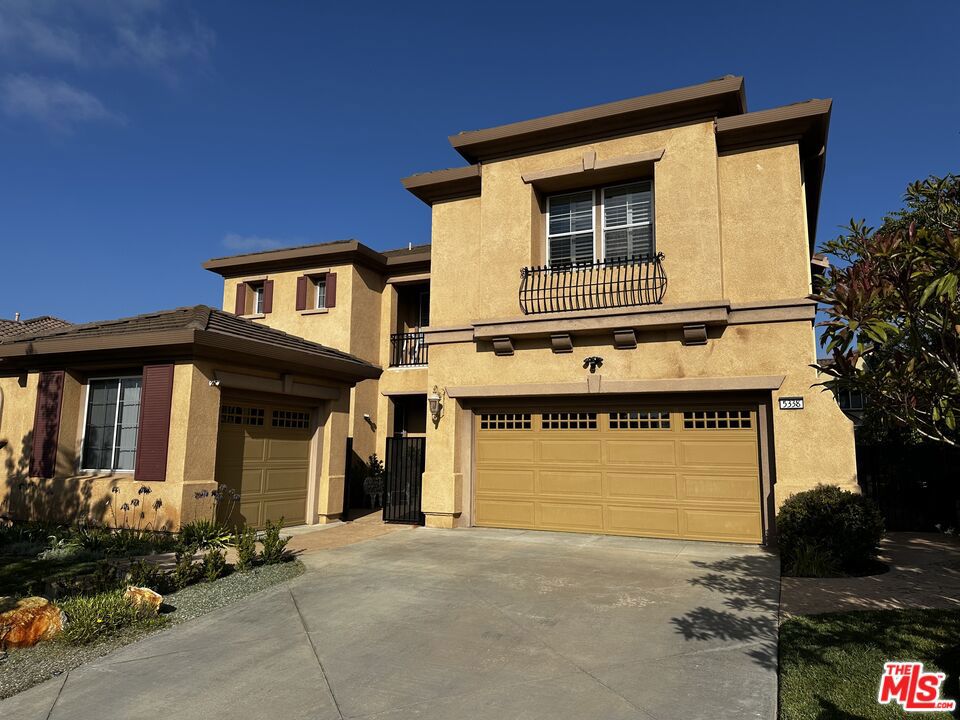 Experience Tuscan-Style Living at Its Finest. This elegant Tuscan-inspired residence showcases luxury features typically reserved for multi-million-dollar homes. From custom plantation shutters and hickory wood flooring throughout, to bespoke closet cabinetry, built-in appliances, a walk-in pantry, and integrated surround sound, every detail is designed for comfort and sophistication. Offering 4 bedrooms, 3 baths, a den, and spacious family room, the home provides both style and functionality. The third-car garage offers flexibility as a private office, casita, or garage space. Outside, a spa and entertainer's patio create the perfect setting for gatherings and relaxation. This property is a rare gem delivering exceptional luxury without the premium price tag.