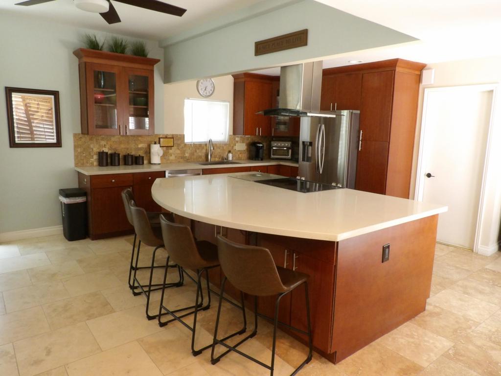 Meet your new poolside desert retreat! This 1,400 sf condo has been completely remodeled with modern kitchen and bathrooms, tile flooring throughout, plantation shutters, recessed lighting, upgraded electrical, newer HVAC system and water heater, and solar panels. Both primary bedrooms have en suite bathrooms with large walk in showers, access to outdoor patios, and one has a walk in closet and Murphy bed. The direct access 2-car garage has built in storage, washer and drier, and an EV charger. Whether you're looking for a vacation getaway, investment property, or year round residence this is a must see. Cathedral Canyon CC is a private gated community with golf and tennis, and it's just a short drive to the airport, downtown Palm Springs, and all the great shopping, dining, entertainment, and events throughout the valley.