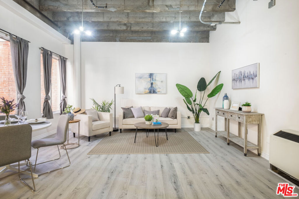 800sf loft in the heart of Downtown LA. Live/Work building, office or business use OK. The expansive space is bright and airy with large windows, 12 ft. ceilings. Brand new wide plank flooring. An open floor plan kitchen w/ new quartz kitchen countertops, an expanded breakfast area plus quartz backsplash. New dishwasher & microwave. Washer and dryer in unit. A private bedroom area away from the living area, and private balcony. Secured building amenities include 24 hours doorman, a rooftop pool & spa with panoramic city views, fitness center, and common areas. No need to drive, walk to the best of DTLA: in the heart of the Historic Core, right on 5th and Broadway, next to Perch, Last Bookstore, 2 blocks from Grand Central Market. Stroll to the Ace Hotel, restaurants, bars and lounges. Next to Pershing Square, the Metro Redline Station is right at building. Don't miss this opportunity to live-work and play in Downtown LA.