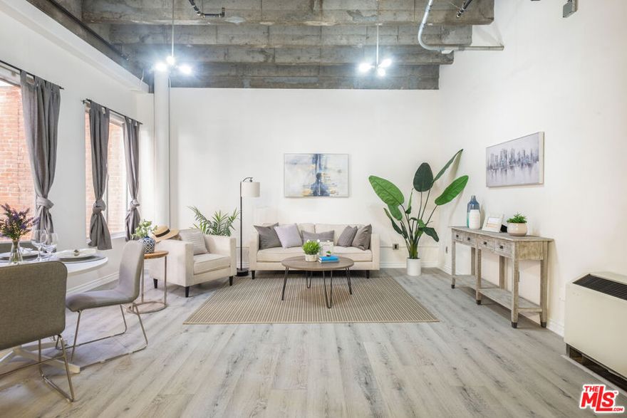 800sf loft in the heart of Downtown LA. Live/Work building, office or business use OK. The expansive space is bright and airy with large windows, 12 ft. ceilings. Brand new wide plank flooring. An open floor plan kitchen w/ new quartz kitchen countertops, an expanded breakfast area plus quartz backsplash. New dishwasher & microwave. Washer and dryer in unit. A private bedroom area away from the living area, and private balcony. Secured building amenities include 24 hours doorman, a rooftop pool & spa with panoramic city views, fitness center, and common areas. No need to drive, walk to the best of DTLA:  in the heart of the Historic Core, right on 5th and Broadway, next to Perch, Last Bookstore, 2 blocks from Grand Central Market. Stroll to the Ace Hotel, restaurants, bars and lounges. Next to Pershing Square, the Metro Redline Station is right at building. Don't miss this opportunity to live-work and play in Downtown LA.