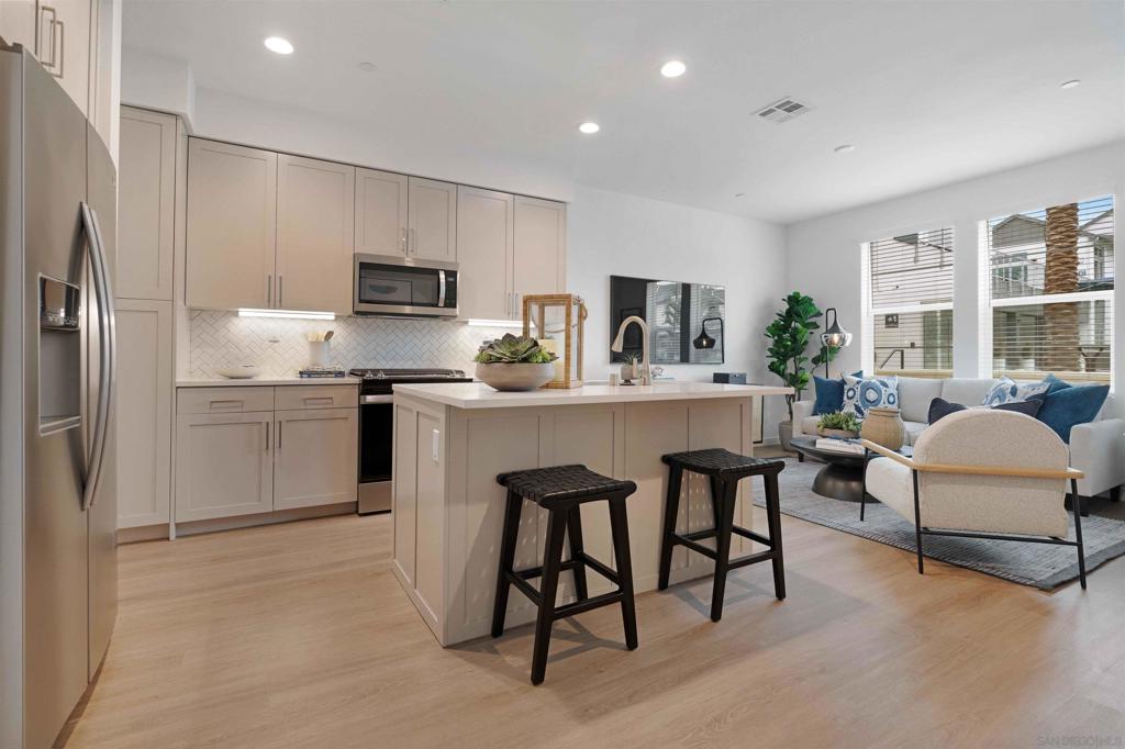 Welcome to Stirling at Cota Vera, a collection of upscale rental townhomes in Chula Vista where space, seclusion and convenience converge. Set across from Central Square Park, these two-story? 1-2 and 3-bedroom homes offer the feel of ownership without the maintenance. Generous floor plans may include flex rooms, powder rooms or lofts. Interiors showcase quartz countertops, designer cabinets, kitchen islands, stainless appliances and recessed lighting atop wood-look plank flooring. Smart door locks and thermostats, keyless entry, direct-entry garages with EV-charging, in-home washers and dryers and ample storage ensure everyday comfort. Outside, a resort-style pool and spa, two-story clubhouse with ocean-view terrace, fitness and yoga/spin studios, coworking space and demonstration kitchen anchor a social scene. Residents also enjoy gaming lawns, multiple playgrounds, open fields, a fire pit and pet-friendly perks like a dog park and pet wash. Solar-powered benefits, community-wide Wi-Fi and a location near top-rated schools complete this Otay Ranch address. Close to concerts and farmers markets, stroll to future shops, stretch in the yoga studio, work from the coworking space, or gather around the fire pit. This community encourages togetherness, whether your day revolves around the pool or exploring the wider Cota Vera neighborhood. At Stirling, you belong to something bigger than your typical townhome community. Experience a lifestyle where privacy, luxury and connection come together in the heart of Otay Ranch at home!
