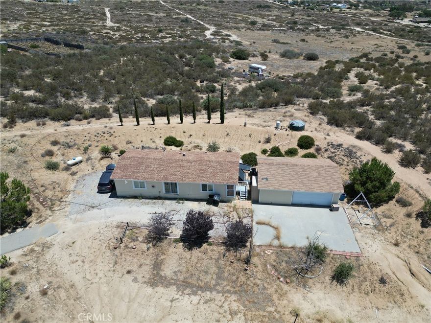This home is completely remodeled, new waterproof luxury vinyl, new toilets, newly painted interior, and newly painted garage interior.
Perfect blend of comfort, privacy, and versatility on 5.35 acres of land. 3-bedroom, 2-bathroom manufactured home is ideally situated to take full advantage of stunning panoramic views of the valley and surrounding town. Currently scheduled to get renovated with New Paint and New Flooring. 
The property also includes a detached two-car garage with an extra bay for a third vehicle, workshop, or storage space. Fully fenced and surrounded by 360-degree views, this peaceful and private setting offers a unique opportunity to enjoy serene country living with convenience and comfort. Just minutes from local shops and services. Endless potential!