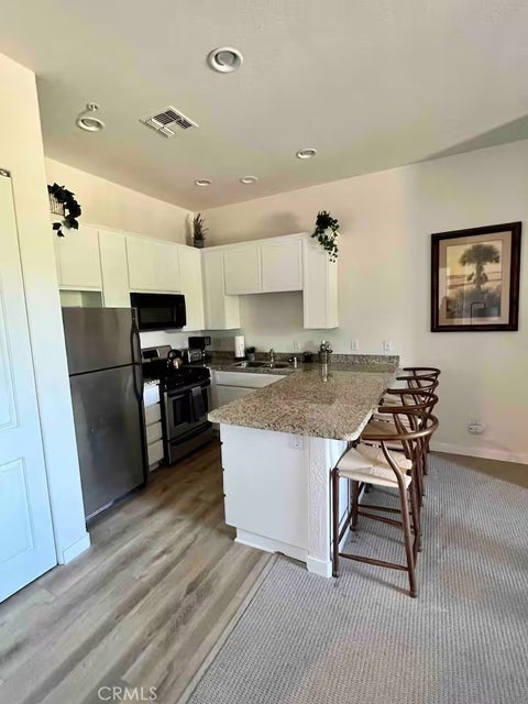Photo of 50590 Santa Rosa Plz #7, La Quinta, CA 92253 (MLS # OC26152844)