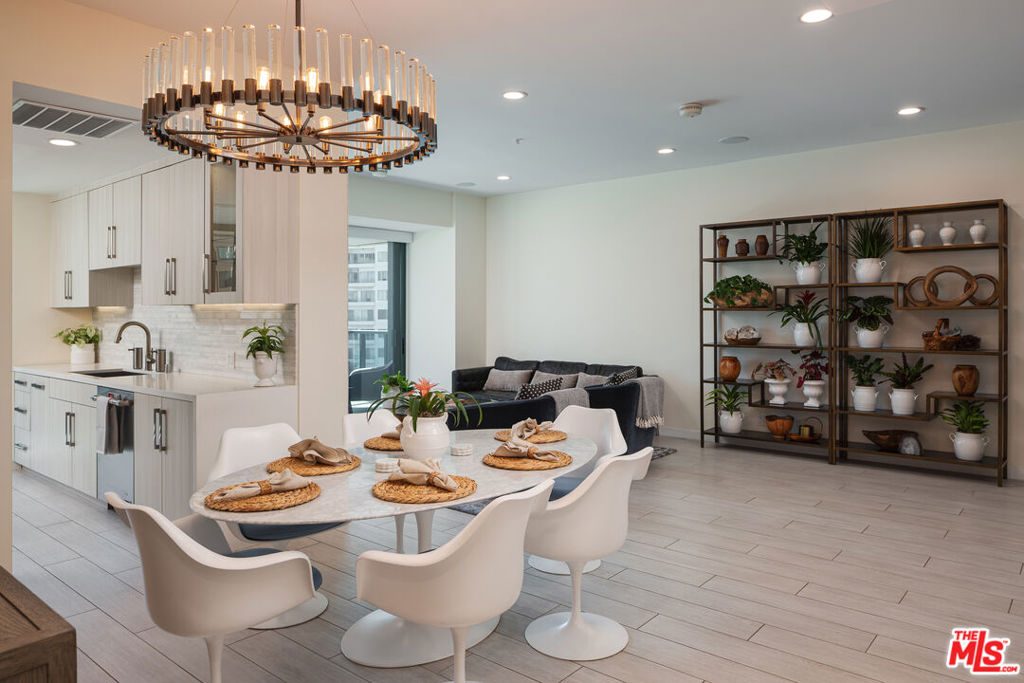 Welcome home! This is your chance to own a designer, fully renovated unit in the prestigious Blair House. An A+ building that is exquisitely maintained, offers 5-star amenities and is just a short distance from Beverly Hills, Century City and UCLA. Just move right in and enjoy the sunsets and ocean views while drinking your coffee, or entertain in your expansive living area which opens to a large terrace. Walls of windows let in an abundance of light. Retreat and relax in your light filled primary bedroom suite, which includes a spacious ensuite bathroom with double sinks, an oversized shower, and a vanity area. A powder room and a large private bedroom, with its own bathroom, on the opposite side of the living area complete the unit. Other luxury features include customized electric European shades, recessed lighting, LED lights inside and under cabinets, custom closets, a wine refrigerator, imported marble from Walker Zanger and a custom built entertainment center that includes a marble television wall and a sound system with built in speakers. The Blair House offers amazing amenities; a resort-style salt water pool and spa, pool side barbecues, a tennis court with a basketball hoop, cutting-edge fitness center, meeting suite, 24-hour valet and concierge, and round-the-clock security. Also included in the HOA is High Speed Internet, Direct TV, Earthquake insurance, Trash, Water and Gas. Don't miss a wonderful opportunity to call this home!