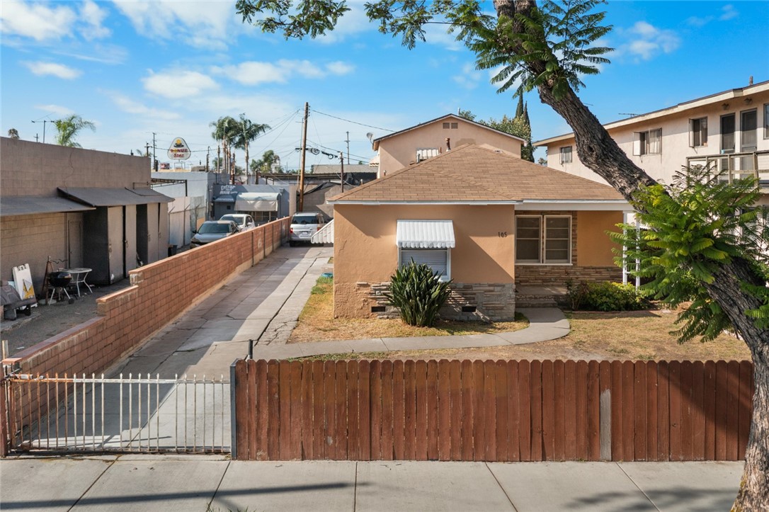 This charming fixer-upper duplex in the vibrant Madison Park neighborhood offers great potential located on a tree-lined street just off Main Street. Unit 1 includes 2 bedrooms, 2 bathrooms, living room, kitchen, dining area, mud/laundry room, and a den. Unit 2 offers 1 bedroom, 1 bathroom, kitchen, living room, with its own private outdoor space. The property includes a spacious storage room with potential for a laundry area, home office, or creative workspace. There is 1 car garage, 1 carport, and a long driveway for tandem parking and conveniently comes with separate electric meters. Centrally located, just south of Downtown Santa Ana, it’s close to the Santa Ana Metrolink Station and multiple transit options. With a walking score of 85, these homes are only steps to grocery stores, pharmacies, coffee shops, restaurants, and daily conveniences along Main and Edinger; with the neighborhood park just a short walk away. Don’t miss this solid investment in one of Santa Ana’s most desirable neighborhoods.