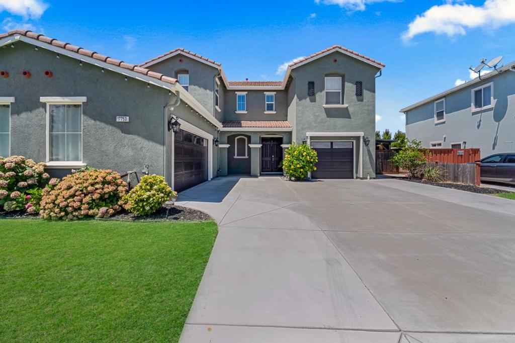 Welcome to this spacious 5-bedroom, 2.5-bathroom home located in the vibrant city of Lathrop. Spread across 2,987 square feet, this residence offers ample space for comfortable living. The kitchen is designed for culinary enthusiasts, featuring modern appliances and plenty of counter space to make cooking a pleasure. Enjoy family meals in the dedicated dining area, perfect for gatherings and entertaining. The home is equipped with central AC and heating, ensuring year-round comfort regardless of the season. Cozy up by the fireplace during cooler months, creating a warm and inviting atmosphere. The property includes a convenient laundry area, simplifying daily chores. Situated on a generous lot of 7,349 square feet, there's plenty of room for outdoor activities. The flooring throughout the home complements its design, adding to its charm. Located within the Manteca Unified School District, this home is ideal for families seeking a community-oriented lifestyle. Additionally, a 2-car garage provides ample space for parking and storage. This Lathrop gem is ready for you to make it your own!