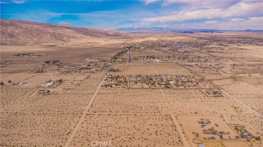 5 Acres of Prime Desert Land in 29 Palms – Minutes from Joshua Tree National Park and Downtown Twentynine Palms!!!
Nestled within the convenient and desirable Hanson area of 29 Palms, this expansive 5-acre parcel offers an exceptional opportunity to create your dream desert retreat or embark on a lucrative development project. Just minutes away from the main entrance and headquarters of Joshua Tree National Park, the location provides easy access to breathtaking natural landscapes and outdoor adventures.
Zoned RS-4, the property is perfectly suited for building a spacious single-family home with ample room to add a guest house and/or accessory dwelling unit (ADU). For investors, the RS-4 zoning allows for higher-density residential use, enabling the subdivision of the land into smaller parcels for multiple homes. Power and water are adjacent to the parcel, making this a best case scenario for ease of development!
Beyond its natural allure, the property is conveniently located near downtown 29 Palms, where you'll find a vibrant community filled with hip shops, cozy cafés, diverse restaurants, and the weekly farmers market. Whether you're seeking a peaceful oasis or a dynamic hub for development, this parcel offers the perfect blend of tranquility and accessibility.
Don't miss out on this unique opportunity to own a versatile piece of land in a prime location. Experience the best of desert living with both natural wonders and urban conveniences at your doorstep!