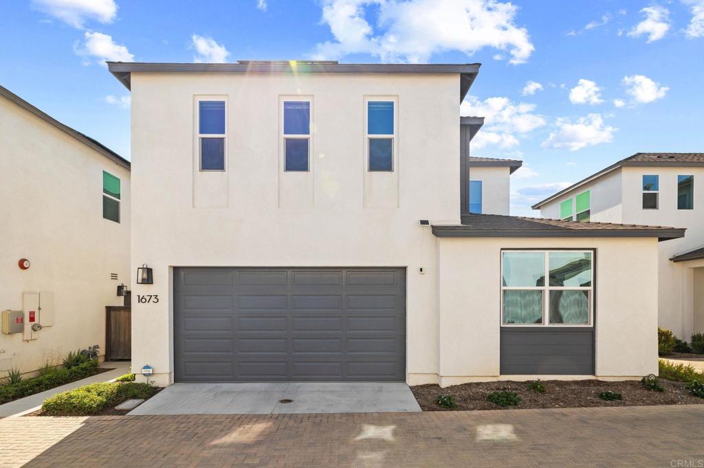 Welcome to 1673 Whitmore Loop, located in the desirable Cota Vera master-planned community of Chula Vista! This 4 bedroom, 3 bathroom home offers 1,947 sq. ft. of bright and open living space with an inviting open-concept layout. Enjoy abundant natural light, a convenient tech center/study nook with dual workstations, and a modern kitchen that flows seamlessly into the living and dining areas. The home features paid-off solar panels, an EV charging outlet, and a spacious 2-car garage. The backyard is designed for low-maintenance enjoyment with turf and pavers, perfect for relaxing or entertaining. A wonderful opportunity to own in one of Chula Vista’s most sought-after communities!