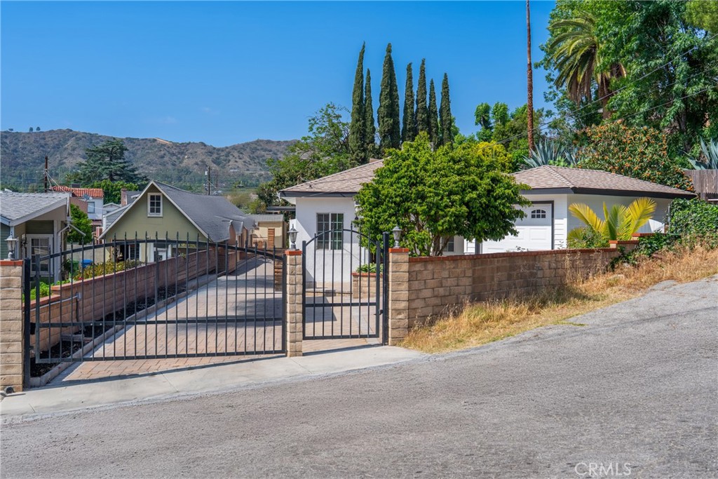 MOTIVATED SELLER!!! Nestled on a peaceful cul-de-sac, this beautifully updated 4-bedroom, 2-bath home offers both comfort and potential. Inside, two separate living areas—one in the front and another in the back—create the perfect setup for gatherings, cozy nights, or flexible work and play. The remodeled kitchen with brand-new appliances, along with refreshed bathrooms, brings a clean, modern feel throughout.
Step outside and you’ll find yards on every side: a welcoming front garden, an oversized backyard ideal for entertaining, and a side yard with space perfect for planting fruit trees or creating your own urban orchard. The expansive lot also provides ample on-site parking and generous outdoor areas for dining, relaxing, or hosting friends and family.
With its ADU potential, this property offers not just a move-in ready home, but also room to grow. Located in the vibrant community of Eagle Rock, you’ll enjoy easy access to local dining, shopping, and the best of Eagle Rock Blvd and Colorado Blvd.