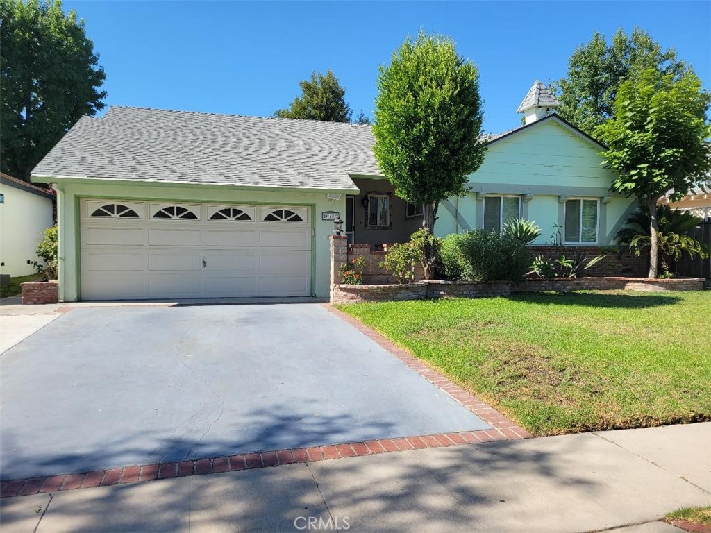 Beautiful Winnetka home located on a quiet tree lined street. Offering 4 bedrooms and 2 bathrooms. The home is 1,666 square feet and situated on a 6,884 square foot lot. Large Living room with floor to ceiling brick fireplace. Sliding glass door opens to the private backyard and oversized covered patio. Bright and open Kitchen. The dining area is off the living room or a separate room off the kitchen; it could also be used as a small office. Remodeled bathrooms. Each room has its own A/C unit. Hardwood floors and ceiling fans throughout the house. 2 car attached garage with additional storage room added. Separate rear entrance with additional private gated parking. Lease includes Refrigerator, washer and dryer in as is condition.