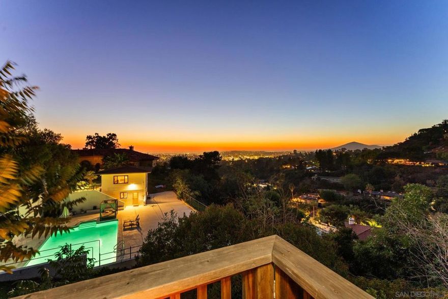 Discover this rare Mt. Helix retreat—a multi-generational oasis with an impressive income-producing track record, sweeping views, premium upgrades, and a truly unique outdoor setting. Perched on just over an acre in one of San Diego’s most sought-after neighborhoods, this property offers unmatched versatility, currently thriving as a high-demand short-term rental.  The main residence features 4 bedrooms, 2 baths, gleaming hardwood upstairs, and LVP flooring downstairs. A detached two-story guest/pool house, with separate entrances, includes showers on each level and a kitchenette in the lower unit—ideal for guests, extended family, or income potential.  A secluded tiny home with 3 sleeping areas, its own deck, barbecue, full gas stove, and microwave adds even more flexibility.  Outdoors, a custom 35-foot man-made river winds through the property, creating a tranquil ambiance. Meandering trails invite morning or sunset walks, meditation, or quiet reflection. Enjoy the sparkling swimming pool, soaking pool, and expansive patios perfect for entertaining or relaxing. Large picture windows capture breathtaking vistas, while the upstairs deck sets the stage for al fresco dining.  Upgrades include granite countertops, solar, updated plumbing in the main home, a new water heater, and abundant storage. Whether you’re seeking a serene personal escape or a proven income-generating property, this Mt. Helix gem offers it all.