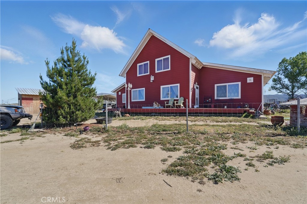 *TWO PARCELS FOR ONE PRICE!!* Welcome to your handcrafted sanctuary in small town Anza, California! This custom-built home, completed in 2008, sits on a flat, very usable and fenced 10-acre property and is designed with meticulous attention to detail. Surrounded by untouched raw land, this property delivers the full off-grid experience with wide-open skies, quiet evenings, and endless potential for your homesteading dreams.
The home features three spacious bedrooms, three and a half bathrooms, complemented by sky-high vaulted ceilings that create an open airy atmosphere. This home was built with durability in mind. It is constructed using 2x6 wall studs, ensuring strength and long lasting. The property is fully insulated, providing comfort throughout the four seasons. For added convenience, the house includes a whole-house fan unit to keep the air flowing and energy costs down.
Outside, you’ll find three chicken coops, a large horse stall with a two-stall shelter featuring a metal roof, a large enclosed goat pen, and a hot-wired horse pasture covering on one acre. Additionally, two full RV hookups, perfect for guests or extended stays. Access to the property is secure and private with a 20-foot double-swinging electric gate and an additional swinging gate for enhanced security. With every detail carefully considered, this property offers a unique blend of comfort, and the country homestead lifestyle. Schedule your touring today!
