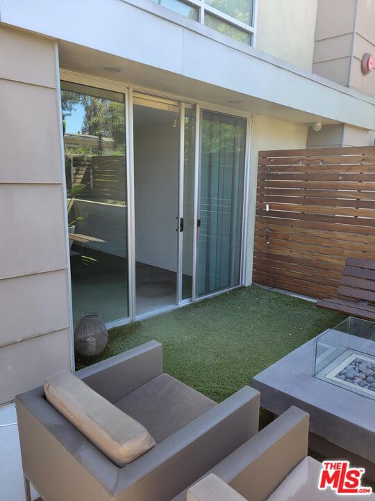 Beautiful and pet-friendly 1-bedroom apartment in the heart of Hollywood, just one block from Paramount Studios and a 5-minute walk to the historic, restaurant- and store-lined Larchmont Blvd. The bathroom has been upgraded to feature a standing shower with a bench and glass doors. The kitchen is fully equipped with a microwave, oven/stove, dishwasher, and refrigerator. Central A/C is controlled by a Nest thermostat. The spacious living room/dining area includes a gas fireplace for a cozy touch. Sliding doors lead to a large (200 sq ft) private patio with a side gate for convenient additional access to the property. The apartment is located on the first-floor corner of a condo building. The neighbors are quiet and friendly, contributing to a community-like atmosphere among residents. The building features a gated underground parking garage, with two designated spaces for this unit, several guest spaces, and two electric car chargers.