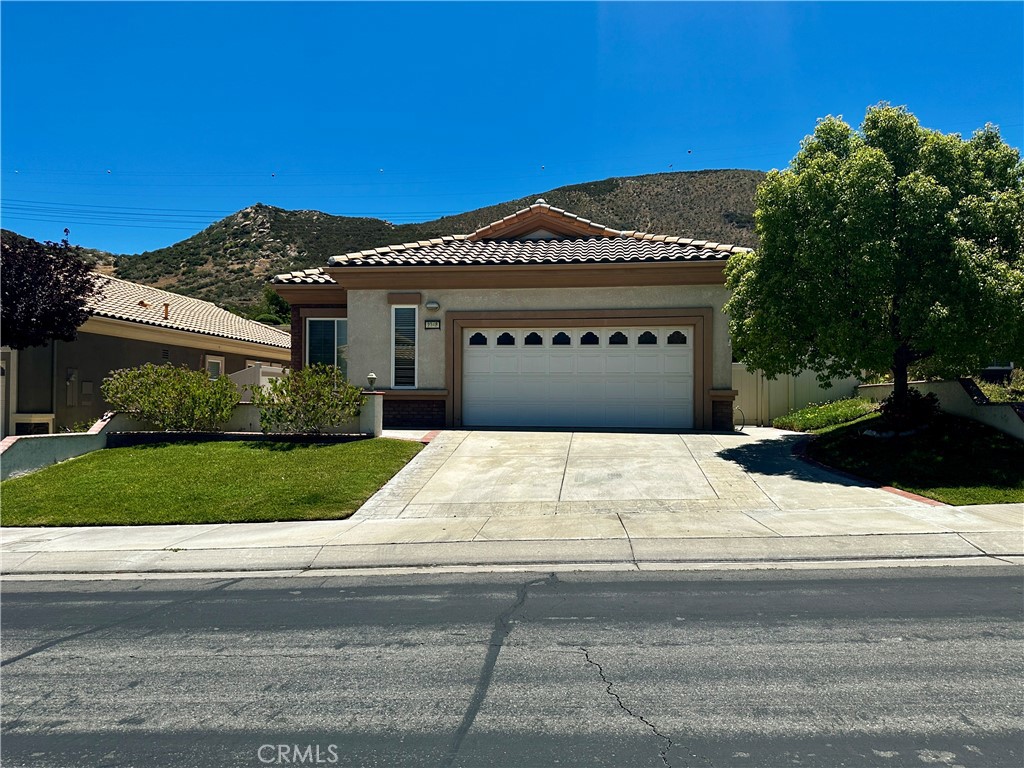 BEAUTIFUL "EXTENDED" PULTE PAVE MODEL!! GREAT ROOM HAS BEEN EXTENDED TO TAKE ADVANTAGE OF FORMER PATIO COVERED BY ROOF!! HOME HAS OVER-SIZE BACK YARD WITH ALUMAWOOD PATIO COVER - PART SOLID/PART SLATTED!! THIS IS ONE OF ONLY EIGHT PAVES BUILT THIS FAR SOUTH IN SUN LAKES SURROUNDED BY MUCH LARGER HOMES!! "BRAND NEW ROOF" HAS JUST BEEN INSTALLED ON WHOLE HOUSE!! ELEGANT CROWN MOLDING, SHUTTERS & CEILING FANS THROUGHOUT!! COUNTERTOPS IN KITCHEN ARE STUNNING GRANITE WITH DESIGNER BACKSPLASH AND LOWERED BAR AREA TO BETTER VISIT WITH COMPANY!! FLOORING IS ATTRACTIVE CERAMIC TILE WITH CARPET IN GREAT ROOM & BEDROOMS!! BOTH BATHROOMS HAVE BEEN UPGRADED WITH CUSTOM DESIGNED SHOWERS & WATERPROOF WOOD IN PRIMARY!! OFFICE HAS BUILT-IN DESK, CABINETS & STORAGE!! HOME HAS LOTS OF EXTRA STORAGE IN GARAGE!! BACKYARD HAS MANY FRUIT TREES - NECTARINE, POMEGRANITE, LEMON, AND ROOM FOR MORE TO BE PLANTED........
SUN LAKES IS A FABULOUS GATED/GUARDED "ACTIVE ADULT" COUNTRY CLUB with TWO 18-HOLE GOLF COURSES - Championship & Executive!! Amenities include Pro Shops, Driving Range, Sports Courts for Tennis, Pickleball, Bocce & more, TWO RESTAURANTS with Bar/Lounge & Outside Veranda (with Entertainment), THREE CLUBHOUSES with Pools/Spas (one indoors), Three Fully-Equipped Gyms, Ballroom w/Stage, Billiards, Library, Craft Room w/Classes and OVER 80 Clubs & Activities for your Enjoyment!! PLUS PRIVATE RV STORAGE!! HOA FEE INCLUDES CABLE TV & INTERNET!! Sun Lakes is close to EVERYTHING!! Less than an hour to Mountains, Desert, & Beaches and MINUTES to Desert Hills Premium Outlets and MORONGO CASINO!! COME VISIT AND MAKE THIS YOUR NEW DREAM HOME!!