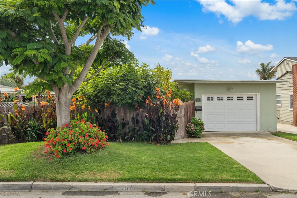Step into this charming 3-bedroom, 2-bath home on peaceful Paloma Drive that feels straight out of a storybook, nestled on a beautifully landscaped 6,500+ sq ft lot. One of the few homes in the neighborhood with both a fully enclosed front and backyard, it offers a rare sense of privacy and tranquility from the moment you arrive. Sunlight pours through skylights and large windows, highlighting the warmth of hardwood floors and the inviting glow of a cozy gas fireplace. The updated kitchen is both stylish and highly functional, featuring solid wood custom cabinetry, quartzite countertops, a commercial-size range, a slide-out pantry, an appliance garage, and soft-close drawers with added storage throughout. The spacious primary suite offers a spa-like escape, while the garden feels like your own private retreat, with winding paver paths, lush greenery, and a peaceful back porch perfect for quiet mornings or evening unwinding. Fruit trees throughout the yard add a sweet touch to the scenery and a treat to tickle your taste buds. Located just minutes from Ventura’s beaches, hiking trails, golf courses, parks, and downtown shops and dining, this turnkey home blends comfort, charm, and storybook appeal.