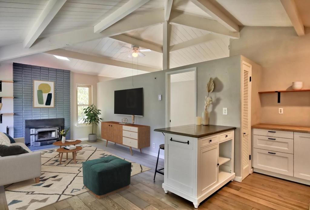 One of the best values in Santa Cruz County! Nestled within the Boulder Creek Golf & Country Club, this charming residence beckons you over a quaint red bridge spanning a serene pond. Inside, discover an open-plan interior featuring vaulted ceilings and cozy fireplace. The updated kitchen w/ open shelving, butcher block countertops, and stainless steel appliances has a breakfast bar and dining area. The large bedroom showcases 2 closets and the bathroom is updated with modern subway tiles and wood shelving. Relax and entertain on the sunny patio. There is also a partial garage, suitable for a single car or additional storage, and guest parking is available. This home is part of the Boulder Creek Golf Club, which offers many amenities including pool, restaurant, and opportunities for disc and traditional golf. Nearby, enjoy world-class hiking at Big Basin Redwood State Park, a swim in the river at Junction Park, or enjoy the vibrant community of downtown Boulder Creek's natural food stores, popular eateries, and boutique shops.