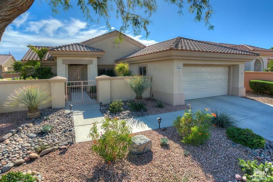 Sun City Palm Desert- Waterford. Located a short distance to the Mountain View clubhouse this nicely upgraded home has a garden-like south facing rear yard w/an extended patio, raised planters, an alumawood patio cover. A gated courtyard provide curb appeal. Inside, rich bamboo flooring is in all but the kitchen laundry & bathrooms which have 18 inch tile. Rounded hall entryways & transom windows provide an elegant and light environment. The kitchen has slab granite counters w/rounded edges, stainless appliances & a breakfast bar. The master suite has a cathedral ceiling and his & her closets. The remodeled master bath has slab granite counters, dual sinks w/chrome fixtures & a stall shower w/tile surround & glass tile accent. The upgraded guest bathroom has a shower/tub, slab granite counter & upgraded fixtures. The laundry room has built-in storage. The spacious garage has hanging rack & builtin storage. The home is equipped w/upgraded Lennox HVAC w/electronic air filtration.