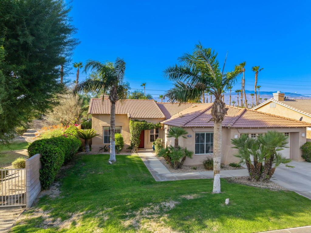Welcome to Monticello II! This south-facing pool home blends comfort, smart upgrades, and mountain views in a prime location. Featuring 3 bedrooms, 2 bathrooms, and a 2-car garage, the home boasts a beautifully designed backyard with unobstructed views of the Santa Rosa Mountains. The custom pool, spa, and Alumawood patio cover were built and have been continuously maintained by Teserra (formerly California Pools). Inside, enjoy a cozy fireplace, pro-installed HDTV antenna for free local channels, pre-wired security system, and a smart attic fan that activates at 116F+. Recent upgrades include a new pool motor and controller, 2021 HVAC, and 2020 water heater. The backyard offers timer-controlled lighting and an RV gate with space--just needs paving. Located within the IID district for lower electric bills and ideally set on the Indio/La Quinta border, close to shopping, dining, and freeway access. Low HOA of $100