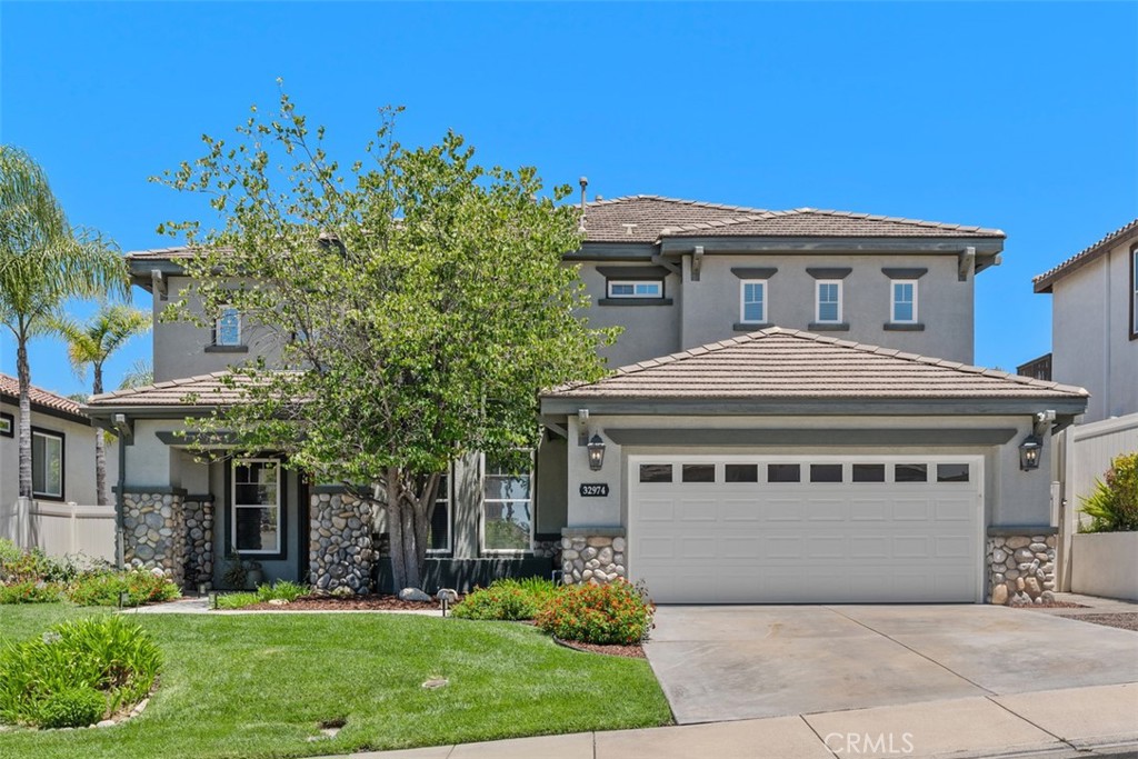 Temecula's premier community...Eagle Point in Redhawk, located in the highly sought-after Great Oak School District. This is a Continental-built Plan 3, home offering a thoughtful layout with a full Bed & Bath downstairs—perfect for family members, visiting guests, office, crafts room, home schooling, etc.
Enter into a dramatic living room and formal dining area w soaring vaulted ceilings bathed in warm morning sunlight. The gourmet Kitchen has been completely redesigned with solid wood cabinetry, self closing drawers and cabinets, media niche, with an oversized island & breakfast bar topped with custom granite countertops, Thermador stainless steel appliances, and dual 40-bottle wine fridges. The cozy informal dining area looks out to the landscaped and private backyard. The spacious Family Room is open to the Kitchen, creating an ideal gathering space, w media space and fireplace and a bank of windows looking out to the covered patio and lush backyard. Upstairs, you’ll find the ultimate Master Suite with an extra sitting area and panoramic views. The Master Bath showcases a marble shower with frameless glass enclosure, an oversized heated jetted tub, brand-new vinyl plank flooring and a custom-designed Master Closet. Three additional bedrooms and a full Bath upstairs are complemented by built-in custom cabinetry. Brand-new carpeting has been installed throughout the home, adding comfort and a fresh, modern feel. From the family room, pass thru the French Door to the entertainer’s backyard featuring stamped and colored concrete, four gathering areas (one fully covered), a firepit, and natural gas/electrical hookups ready for your outdoor kitchen or spa. Additional upgrades include a fresh interior and exterior paint, an upgraded Day & Night HVAC & heating system with dual-zone coverage, Venstar wireless thermostats, and a HUE lighting system. The 3 car tandem garage offers ample space for vehicles, toys and storage and with the home located on a cul-se-sac, you'll enjoy a peaceful, quiet lifestyle. See this well cared for and meticulously maintained home today.