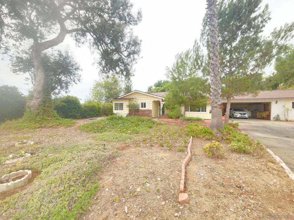 Cozy cottage located at the end of a private drive in classic Vista Valley. Home has been updated and features spacious rooms, 2 full baths, in house laundry, attached 2 car garage with large workshop. Whole house soft water system and A/C make this home complete. Rambling outdoor spaces, plenty of foliage and mountain vista views. Unique opportunity for those wanting space and privacy but the conveniences of town. Close to metro station, shops, restaurants and easy freeway access.