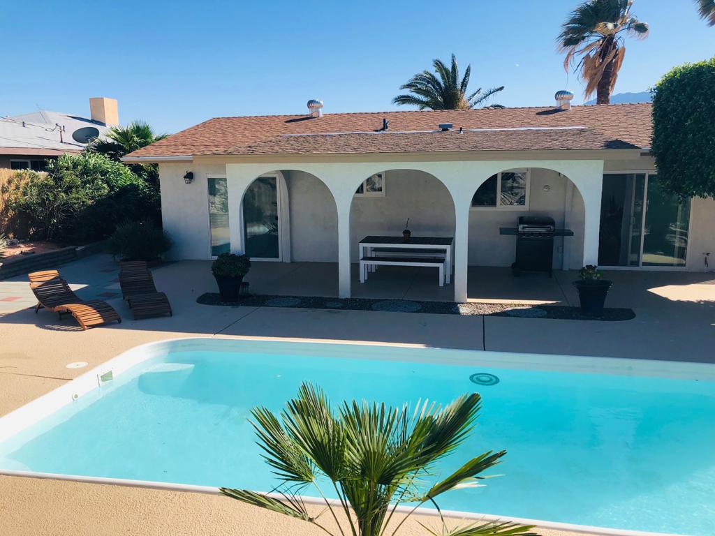 Private Pool and Spa, Unfurnished, Long-Term LeaseFramed by lush palms, majestic mountains, and vibrant desert landscaping, this impeccable single-story home offers the perfect blend of comfort, style, and breathtaking scenery. Located just minutes from downtown Palm Springs, this beautifully remodeled 2-bedroom, 2-bath residence provides approximately 1,120 sq. ft. of open and inviting living space. The photos show the property staged, the property in unfurnished.Inside is bright, spacious living room and dining area with picturesque views from both the front courtyard and back patio. The fully remodeled kitchen boasts stainless steel appliances, rich cabinetry, a breakfast bar, and more stunning patio views.The primary suite is filled with natural light and features an en suite bathroom and direct patio access. The second/guest bedroom is spacious. The second bathroom has a bathtub. There is a laundry area (washer and dryer) in the two-car garage.Outdoors, enjoy the generous covered front courtyard for peaceful mornings or colorful sunsets. The backyard offers a covered patio, sparkling pool, spa, and an elevated patio deck showcasing panoramic mountain vistas.Highlights:2 Bedrooms / 2 BathroomsFully remodeled with stainless steel appliancesCovered front courtyard & back patioPrivate pool, spa & elevated viewing deckBreathtaking desert & mountain viewsJust minutes to shopping, dining & entertainmentThis home offers the ultimate in desert living for those seeking a comfortable long-term rental with resort-style amenities.
