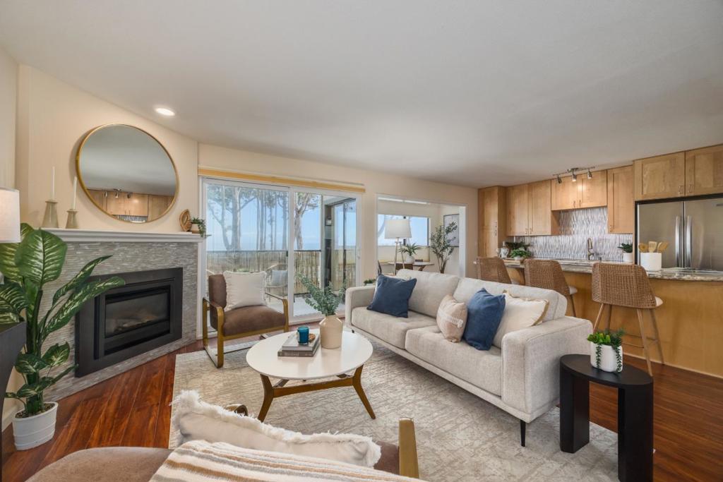 Imagine waking up, making coffee, and realizing the ocean isn't just a backdrop, it's the main event, right in your face, every single day. Full, sweeping ocean views that make you stop and take it in, no matter how many times you've seen it. This fully renovated, turnkey condo is the definition of move-in ready. No DIY weekends. Just unpack, pop some champagne, and check an item off your bucket list. Location? Phenomenal. Downtown Capitola, with its restaurants, boutiques, and beach-town vibe, is a short stroll down the road. New Brighton Beach access is steps away, so you can dip your toes in the sand whenever the urge hits. And when you actually need to commute (ugh, real life), highway access is a breeze. Bonus points: there's a pool. Because sometimes you want water without the sand in your shoes. This place is all about lifestyle: live where others vacation, soak up the views, and enjoy the convenience of one of the best spots on the coast. Turn the key. Drop the bags. Welcome to your ocean-view life.