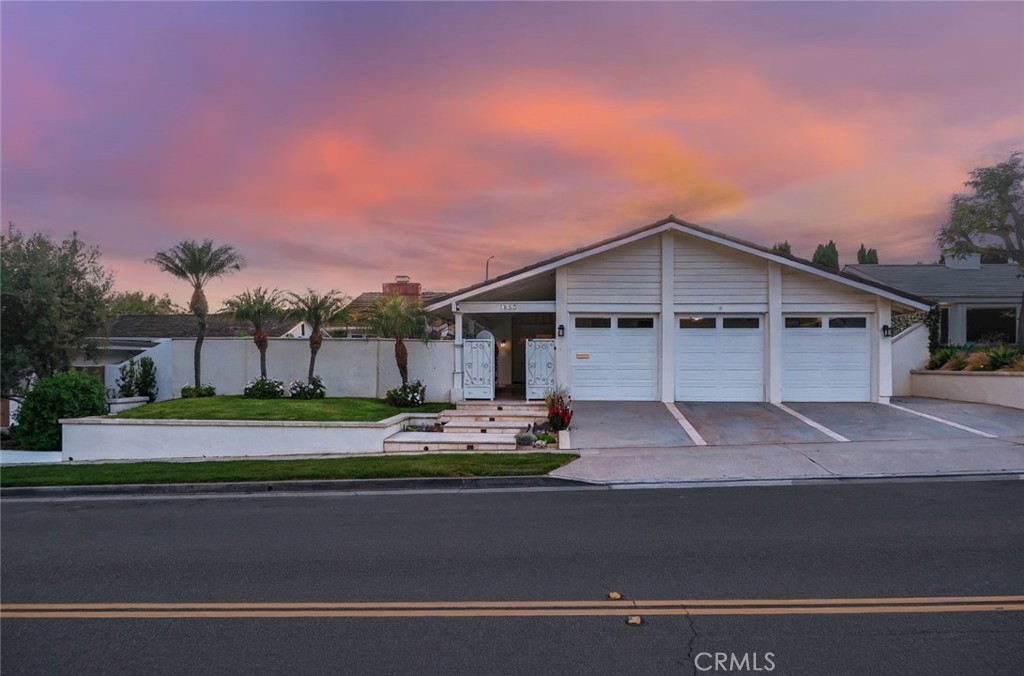 Experience effortless single-level living in this beautifully upgraded Harbor View Hills South home. Thoughtfully designed with both family comfort and refined style in mind, this 4-bedroom, 2.5-bath residence offers a seamless indoor-outdoor lifestyle in one of Corona del Mar’s most desirable neighborhoods. A private, gated front yard with a heated pool and automatic cover creates a resort-like setting while preserving a spacious, lushly landscaped backyard—perfect for entertaining or play. Inside, the formal living room features soaring ceilings, elegant crown molding, and a cozy fireplace, flowing into the dining area with French doors that open to the patio for effortless alfresco dining. The gourmet kitchen is a chef’s dream, complete with a built-in Sub-Zero refrigerator, double wall ovens, 5-burner cooktop, granite countertops, and custom cabinetry with generous storage. The adjacent family room also opens to the backyard through French doors, creating a light-filled, open-concept living space. The primary suite offers serene garden views and backyard access via French doors, along with a spacious walk-in closet and a remodeled en-suite bath with dual vanities and a custom-tiled shower. Three additional bedrooms provide flexibility—two are carpeted and generously sized, while the fourth is ideal for a home office with built-in storage. The guest bath also features dual sinks and a beautifully tiled shower. Additional highlights include a laundry room with direct access to the 3-car garage with epoxy floors and built-in cabinetry, as well as a built-in BBQ and outdoor refrigerator—ideal for year-round entertaining in the private backyard. Enjoy the best of coastal living just minutes from the beach, award-winning schools, upscale shopping, and dining.