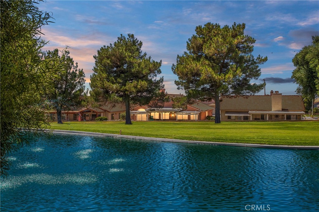 ATTENTION ALL GOLF ENTHUSIASTS!!! Welcome home to Highland Springs Country Club 55+ Community. FREE GOLFING FOR RESIDENTS AND THEIR GUESTS! 2 PRIMARY SUITES!!! This beautiful 3-bedroom, 2 bath home IS IDEALLY SITUATED ON THE 9TH HOLE with stunning views of the Executive Golf Course. The thoughtfully designed open floor plan features a formal living and dining room, separate family room with a cozy fireplace, a lovely kitchen and 2 Primary Suites! There is also a versatile 3rd Bedroom, with a large walk-in closet, ideal for guests, a home office, or craft space. Ample storage throughout the home including an extra deep closet in the hall and above the garage ceiling storage with a pull down ladder. Enjoy tranquil mornings or relaxing evenings on the private patio, where you can take in the lush golf course surroundings—or join in the fun and hit the greens yourself. Highland Springs Country Club features an Executive 9-Hole Golf Course that provides Free Golfing to Residents and their guests. The low monthly HOA fee also includes gated access, clubhouse, tennis and pickle ball courts, swimming pool, hot tub, and gym. Residents are also welcome to stroll the golf paths after sunset. Conveniently located just minutes from shopping and hospital/medical offices and just a short drive to Casino Morongo and Palm Springs. Come experience this vibrant community - where every day feels like a vacation!
