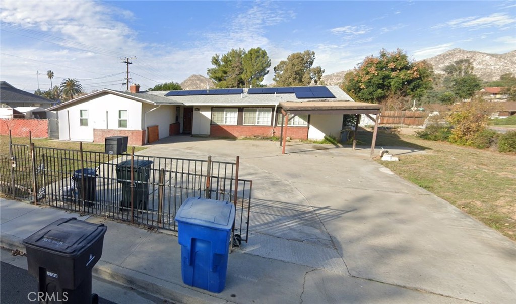Charming single-story 4BD/2BA home on a large corner lot, just 1.5 miles from UC Riverside. Garage has been converted into a spacious bonus room with private entrance—ideal as a family room, home office, or potential ADU (included in living SF on title). Backyard features a sparkling pool, covered patio, and plenty of space to entertain. Long gated driveway offers ample parking. Great opportunity for owner-occupants or investors looking for rental income near UCR. Conveniently located near campus, shopping, and freeway access. Bring your ideas and make it your own!