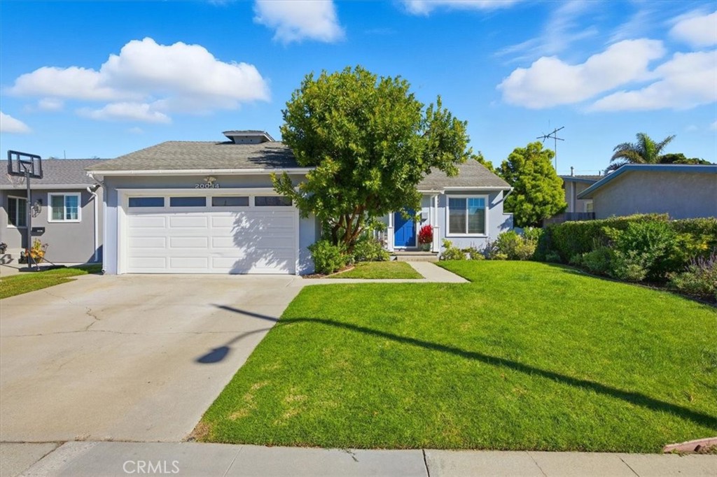 Located in one of West Torrance’s most desirable neighborhoods, this beautifully updated home blends comfort, craftsmanship, and coastal charm. Step inside to a light-filled layout with a natural flow between the living, dining, and kitchen areas, creating an inviting space for both daily living and entertaining. The kitchen features Caesarstone countertops, new stainless steel appliances, and a spacious breakfast peninsula that serves as a perfect gathering spot. Throughout the home, wide plank French oak floors add warmth and elegance, while double pane windows fill the rooms with light and help maintain a peaceful interior. Both bathrooms have been thoughtfully remodeled with stylish finishes and timeless tile work. The bedrooms are generously sized, offering comfort and flexibility for family, guests, or a home office. A large walk-up attic, tall enough to stand in, provides exceptional storage space. Outside, enjoy a landscaped front yard and a private backyard retreat surrounded by mature greenery and fruit trees, ideal for relaxing or outdoor gatherings. This home is within walking distance of Towers Elementary, Bert Lynn Middle School, and West High, three award-winning West Torrance schools. It’s also close to parks, shopping, and just a short drive or bike ride to the beaches of Hermosa and Redondo.
