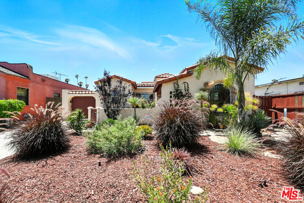 It's your opportunity to lease a large stunningly remodeled Spanish Revival home nestled in a quiet, well-established pocket of Los Angeles. This spacious 4-bedroom, 3-bathroom residence seamlessly blends timeless architectural character with modern upgrades. Step inside to a light-filled living room featuring a beautiful decorative fireplace, arched entryways, and updated wood flooring throughout. The gourmet kitchen has been thoughtfully renovated with quartz countertops, custom cabinetry, and stainless-steel appliances ideal for home chefs and entertainers alike. Enjoy flexible living with a large bonus den perfect for a media room, home office, or playroom. Upstairs, retreat to the expansive primary suite complete with an ensuite bathroom for your own private sanctuary. 3 of the bedrooms are downstairs including 1 bedroom with an ensuite bathroom. The layout offers versatility for multi-generational living, guests, or work-from-home needs. Outside, the backyard provides a great space for gatherings, gardening, or relaxing. Located in a sought-after neighborhood near Inglewood, this home offers convenient access to SoFi Stadium, The Forum, LAX, the upcoming Crenshaw/LAX Metro Line, and major freeways. Enjoy being minutes from shopping, dining, and entertainment, all while feeling tucked away on a peaceful residential street. Kitchen Includes brand new Oven/Stove, Microwave, Dishwasher and Fridge.