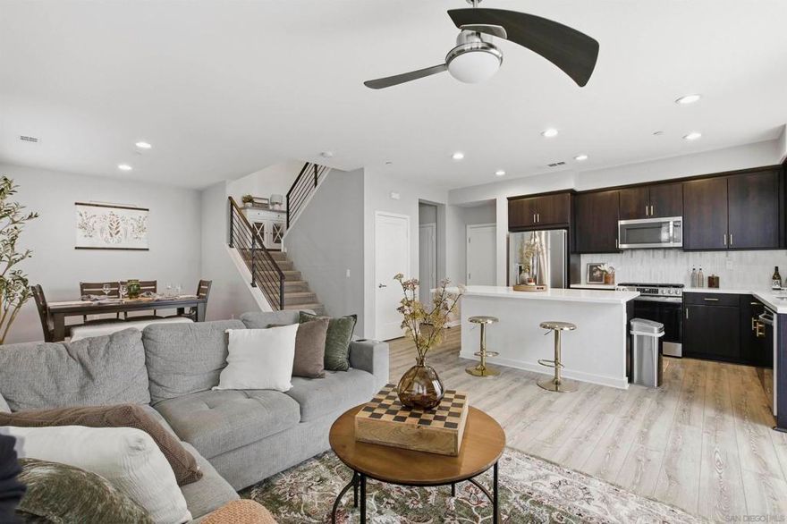 Welcome to this beautifully designed 4-bedroom, 2.5-bath condominium offering 1,692 sq ft of modern open-concept living. Built in 2016, this home perfectly blends style, functionality, and resort-style amenities — making it the ideal place to call home!  Step inside to find bright, open spaces connecting the kitchen, dining, and living areas — perfect for entertaining or relaxing with family. The spacious kitchen offers sleek finishes and plenty of room to create and gather. The private patio invites you to enjoy morning coffee, weekend BBQs, or sunset dinners outdoors. Upstairs, the primary suite features a generous walk-in closet and spa-like bathroom for your daily retreat. Three additional bedrooms provide flexibility for a home office, guest space, or growing family. Enjoy easy living with a 2-car garage, and take advantage of the community’s resort-style features including a sparkling pool and spa, fire pits, grill areas, and beautiful shared spaces to unwind and connect. Located near shopping, dining, gyms, and entertainment at the nearby mall center, and with quick access to Highways 125 & 805, this home offers the perfect balance of relaxation and convenience. Whether you’re a first-time buyer or looking to upgrade your lifestyle — this condo delivers it all: modern comfort, community, and endless enjoyment.