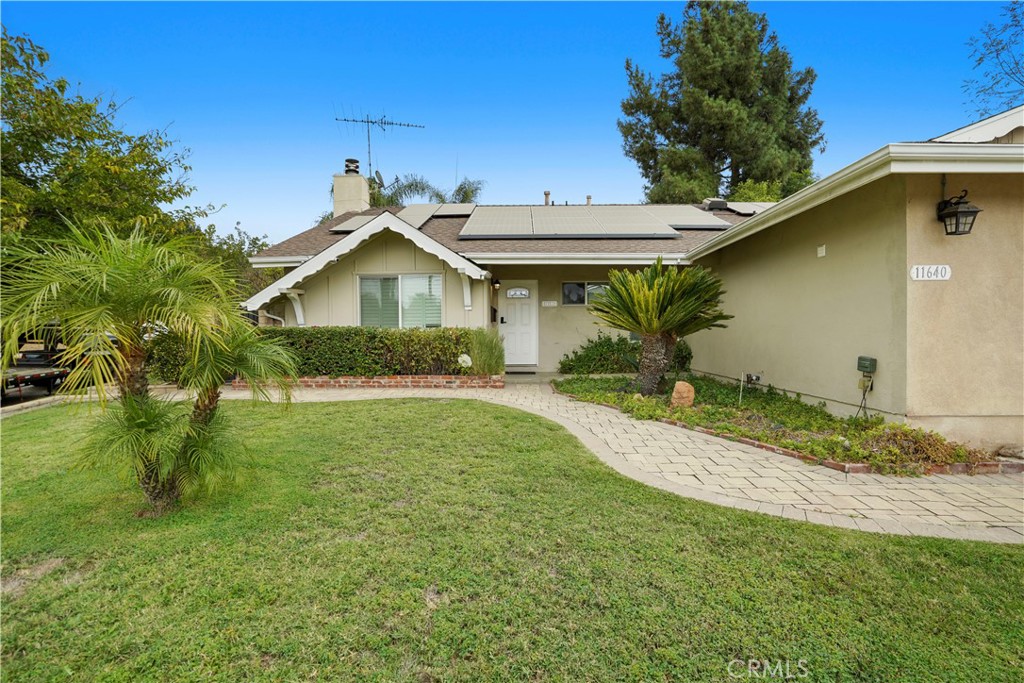 Welcome to your dream home in the heart of Granada Hills, where stunning curb appeal meets modern elegance! This fully renovated gem boasts an inviting open floor plan that seamlessly connects living spaces, adorned with brand new flooring throughout. The kitchen is a true highlight, featuring exquisite quartz counter tops and stainless steel appliances. Overlooking the sparkling pool, the kitchen is an entertainer's delight. With three spacious bedrooms and two beautifully updated baths, this home offers ample space for family. Enjoy the convenience of in-washer and dryer hookups, and take advantage of the energy-efficient solar system. Centrally located near shopping centers and freeways, this property combines comfort, style, and accessibility in one perfect package. Don't miss your chance to make this beautiful home your own!