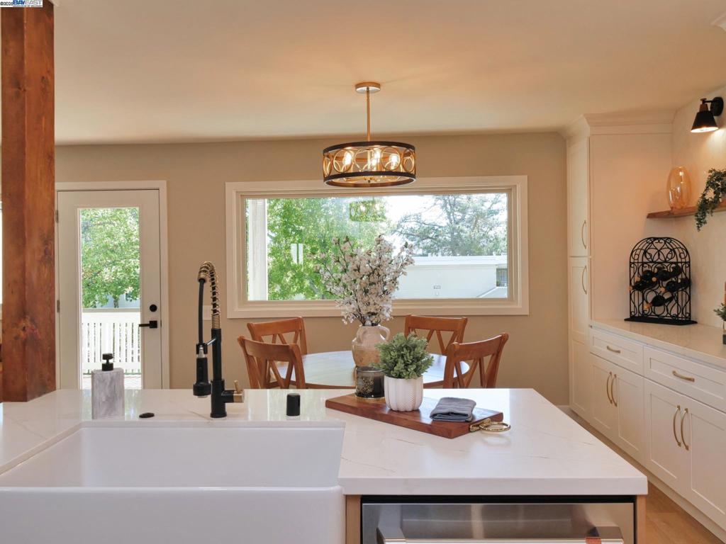 Be the first to live in this reimagined Signature Sonoma model produced by Fred Rooster Renovations and experience the warmth and comfort of this fully renovated home in the heart of Rossmoor's 55+ active community. The inviting open concept living area features thoughtful design and modern touches throughout, with a large island with seating, large farmhouse sink looking out the oversized picture window, induction range with pot filler, quartz countertops and stacked stone fireplace. New Anderson dual-pane windows flood the space with natural light. The primary suite offers a garden view, full-access closets and thru the frosted barn door discover the spacious ensuite bathroom with a curb less shower and heated floor. A second full bathroom includes another walk-in shower. The in-unit full-sized laundry tower, front door smart lock and brand-new hard flooring throughout ensure a safe and comfortable living space. Enjoy the expansive views from the full-size Acacia wood deck balcony complete with large outdoor storage cabinet. Ask your agent about Tailored to Your Taste allowance to enhance your move-in ready home with your personal touches prior to your arrival and start enjoying all that the wonderful community has to offer. ** Bonus Raffel Ticket on Sunday Tour **