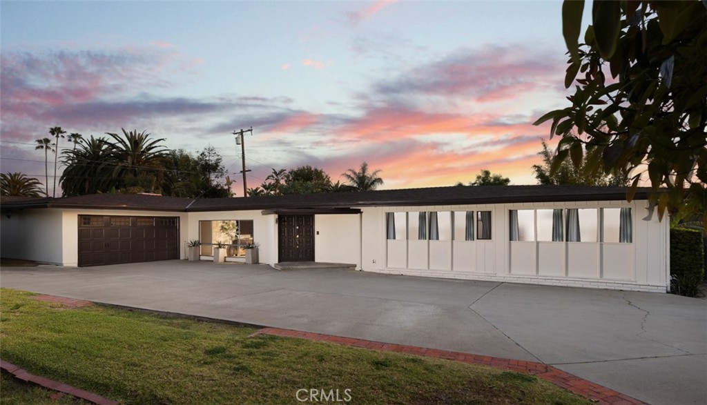 *SINGLE LEVEL *1/2 ACRE *RV PARKING *POOL *PRIVATE
Welcome to your own private retreat in North Tustin! Set on nearly half an acre behind an automatic gate, this sprawling single-story home offers over 3,900 square feet of stylish living. A long driveway leads you to a two-car garage and a home designed for both comfort and entertaining. Inside, an open-concept layout unfolds with wide plank floors, a huge great room, and a seamless flow between living, dining, and family spaces, highlighted by exposed beam ceilings. The remodeled kitchen is a showstopper, featuring sleek German Birch cabinetry, Quartz countertops, a 6-burner Viking range with griddle, double ovens, an oversized island, and a generous walk-in pantry. Unwind with a good book in the inviting library, or host game nights in the spacious game room. Need a home office? With five bedrooms, there’s plenty of flexibility to create the perfect workspace to suit your needs. Outside, the grounds are a true oasis — a sparkling, recently updated pool, peaceful koi pond, and multiple patios offer endless options for relaxing or entertaining. There's also space for an herb or vegetable garden or place for your chickens and animals to roam, plus RV parking with full hookups. An exceptional find in a prime location!