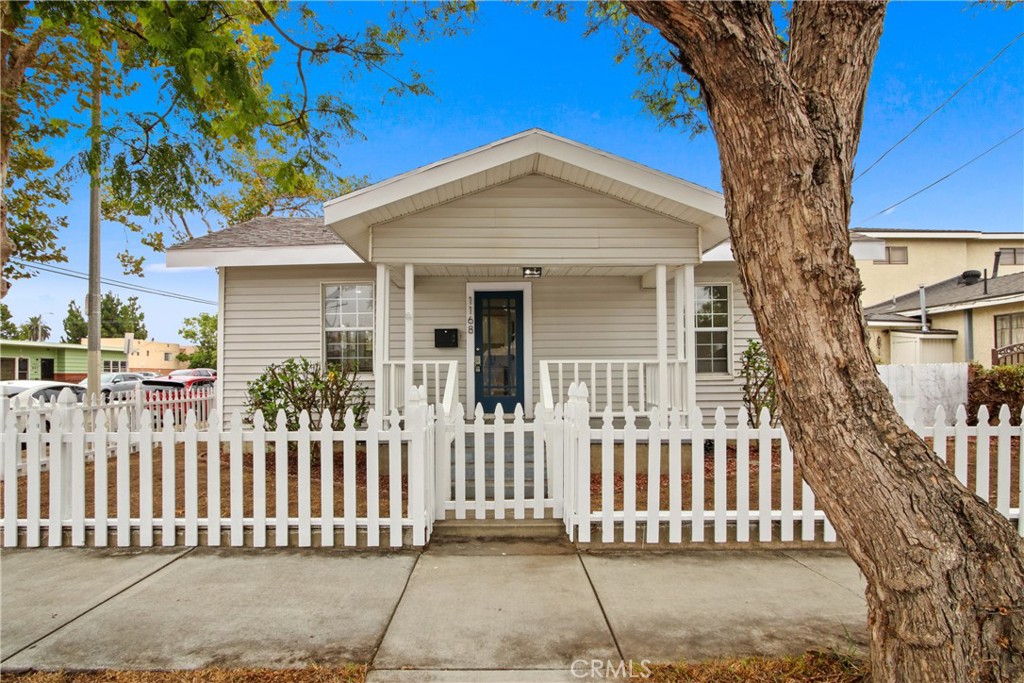 Charming and cozy, this vintage 1910 home is full of character with thoughtful updates throughout. Featuring 2 bedrooms and 1 bath, it sits on a corner lot. Inside, you'll find fresh paint, new flooring, and stylish new appliances that complement the home's classic appeal. Modern comfort is taken care of with bran new ductless mini-split HVAC units. The functional layout includes a convenient laundry room, while the inviting atmosphere makes it move-in ready. A perfect blend of old-world charm and modern updates. This home is a must see.