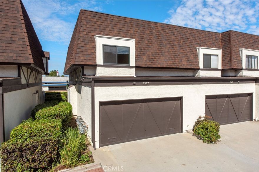 Are you searching for that elusive solution of an affordable property to break into the South Bay real estate market? Here is your opportunity, the newest listing in Artesia Estates. This unit is an end unit townhouse, versatile enough to appeal to a variety of potential owners. Entering through the front gate leads to a private enclosed patio, shaded for the majority of the day. Opening the front door reveals the main living floor with a well lit living room, a wood-burning fireplace, a dining space, and galley kitchen. The kitchen features stainless steel appliances, granite countertops, and pantry storage. Continuing down the hallway is a powder bath to serve the first floor and laundry closet before the garage access door. Climbing upstairs leads to the bedroom level. Both bedrooms are large, have ample walk-in closet space, and en-suite baths. The primary suite features a balcony and walk-in closet. The primary bath has a double vanity with a full tub and shower. The second bedroom is south facing so is well lit with natural light. The second en suite bath has a stand up shower. Back downstairs you’ll find the attached 2-car garage with direct access. This move-in ready townhouse checks many boxes while leaving you the option to upgrade as needed. Centrally located in North Torrance, the location is close to the freeways, shopping, and 5 miles to the beach. Don’t miss this one!