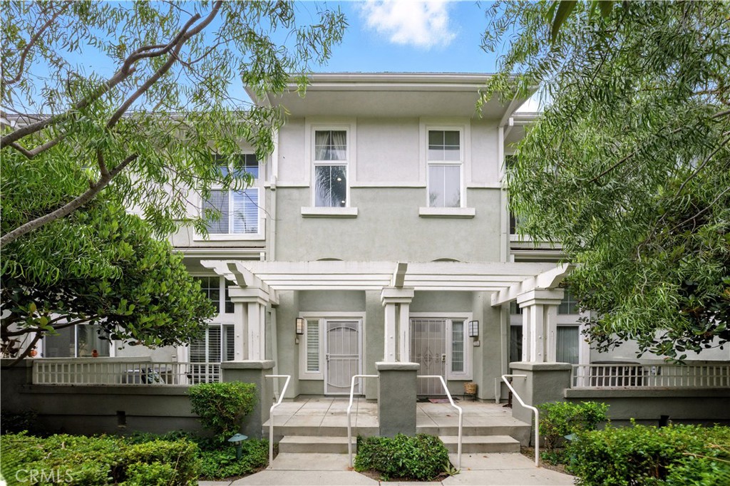 Luxury coastal living awaits in this stunning tri-level townhome located in the exclusive 22-unit Pacific Park Villas community—just minutes from the beach, shopping, dining, and award-winning schools. This 2-bedroom, 2.5-bath residence offers 1,850 square feet of beautifully upgraded living space with sophisticated architectural details and custom finishes throughout. Soaring ceilings, abundant natural light, and an open-concept layout set the stage for elegance, with features including plantation shutters, recessed lighting, crown molding, extensive wainscoting, ceiling fans, dual pane windows, and rich laminate wood and tile flooring. The formal living room boasts a stone fireplace and opens to a private front patio. Up a custom wrought iron and wood staircase, the dining area flows into the gourmet kitchen, complete with granite countertops, a butcher-block breakfast bar, stainless steel appliances, custom cabinetry, beadboard accents, and a tray ceiling in the adjoining family room with access to a second patio. A convenient half bath completes this level. Upstairs, you'll find two spacious en-suite bedrooms, including a luxurious primary suite with soaring ceilings, two mirrored closets with custom built-ins, and a spa-inspired bath featuring dual sinks, tile counters, a soaking tub, and a separate walk-in shower. Additional highlights include central A/C, an inside laundry room, and direct access to the finished 2-car garage with extra storage for bikes, kayaks or toys. Pacific Park Villas offers resort-style amenities including a pool, spa, and clubhouse—perfect for enjoying the relaxed coastal lifestyle year-round.