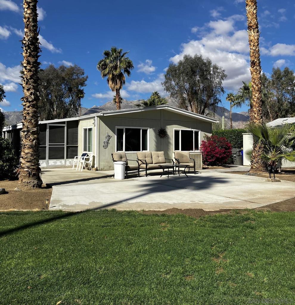 View, View View...Golf cart included...Beautiful 2bd/2ba on the golf course, Freshly poured Back patio overlooking hole 6 & 7 with spectacular Mountain backdrop...Green grass, Palm trees and a 18 hole, par 3 golf course in your own backyard. Low e dual pane windows throughout, beautiful laminate flooring & large screened in porch (California room). All furnishings included. All offers subject to Road Runner Club approval.